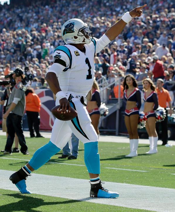 Cam Newton celebrates after throwing a touchdown in the Carolina Panthers 33-30 victory over the New England Patriots in week 4. (AP Photo/Steven Senne)