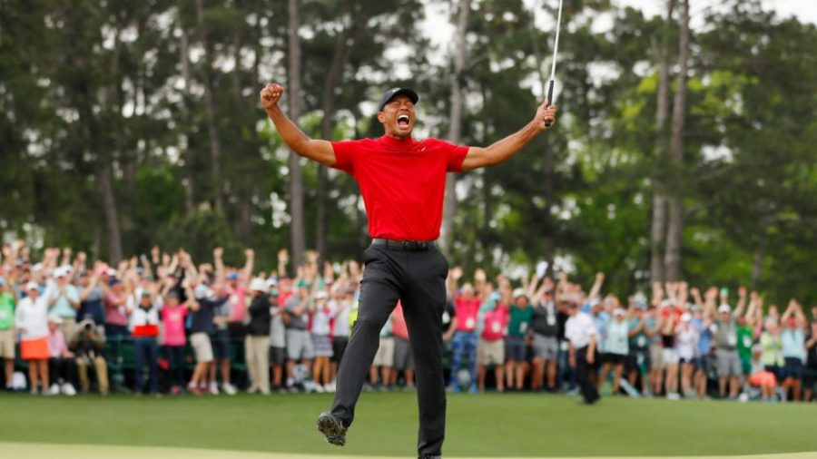 AUGUSTA%2C+GEORGIA+-+APRIL+14%3A+Tiger+Woods+of+the+United+States+celebrates+after+sinking+his+putt+on+the+18th+green+to+win+during+the+final+round+of+the+Masters+at+Augusta+National+Golf+Club+on+April+14%2C+2019+in+Augusta%2C+Georgia.+%28Photo+by+Kevin+C.+Cox%2FGetty+Images%29