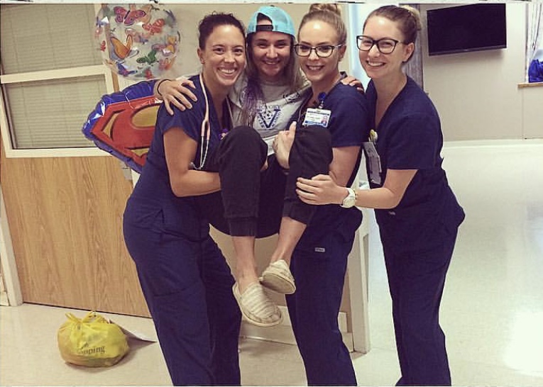 Amanda (center) surrounded by the nursing staff of 6700.