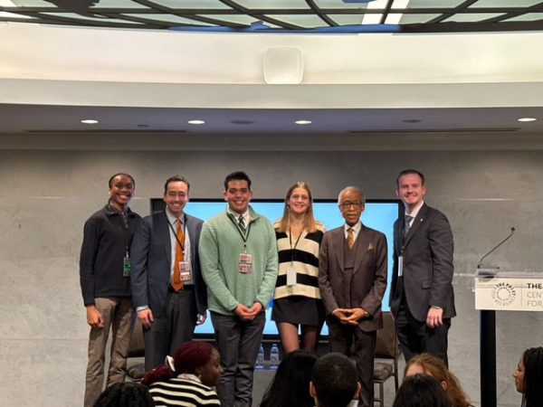 Pictured, left to right: Ujunwa Ike '25; Dr. Nicholas Hirshon; Alexander Felix '25; Julia Menn '28; Reverend Al Sharpton; and William Gifford '28