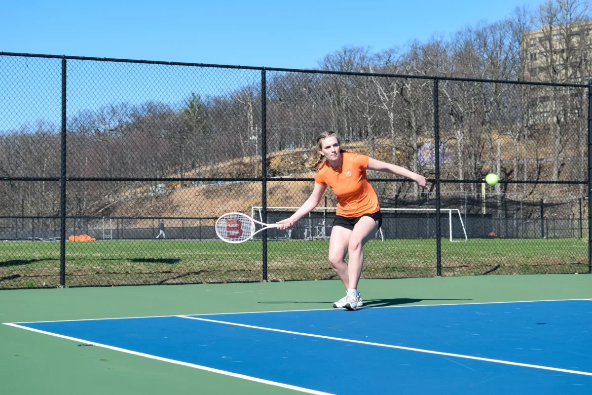 Junior Makayla Yancey playing in a singles match against Mount St. Mary College.