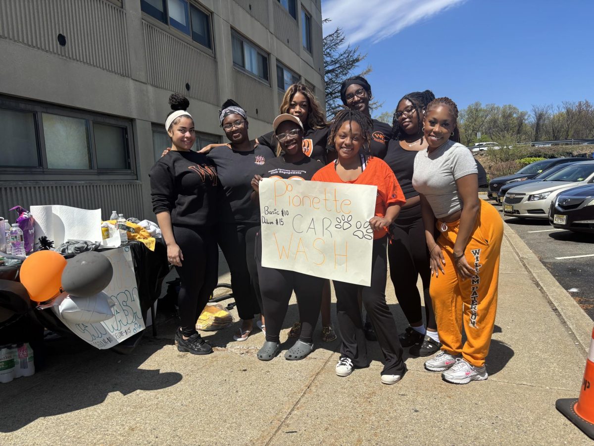 Pionettes stand for a photo outside Pioneer Hall